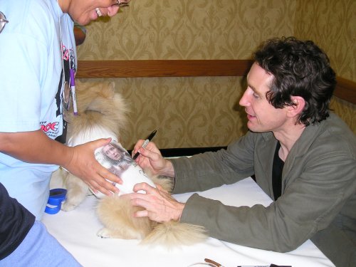 Paul signs Lance's t-shirt.