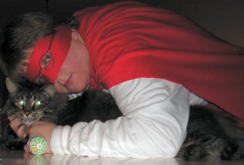 The Metric Avenger cuddles her cat.