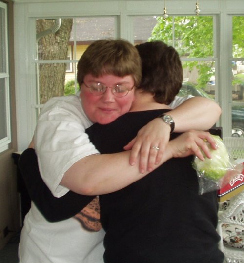 Trina hugs Amy - the surprise part of her party.